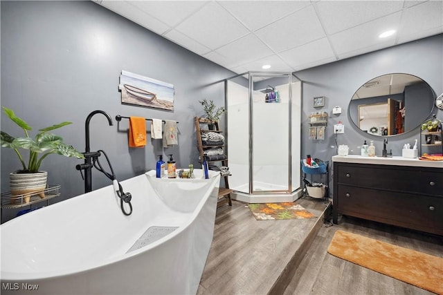 1284 Laurel Dr, West Salem, OH 44287 - bathroom featuring vanity, a paneled ceiling, wood finished floors, a shower stall, and recessed lighting