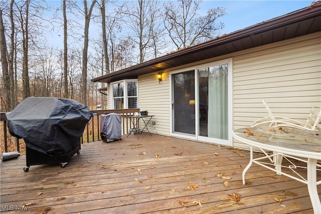 wooden terrace with area for grilling