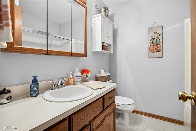 1284 Laurel Dr, West Salem, OH 44287 - bathroom featuring vanity, toilet, and baseboards