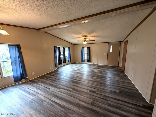 spare room featuring dark hardwood / wood-style flooring, ceiling fan, a textured ceiling, and vaulted ceiling with beams