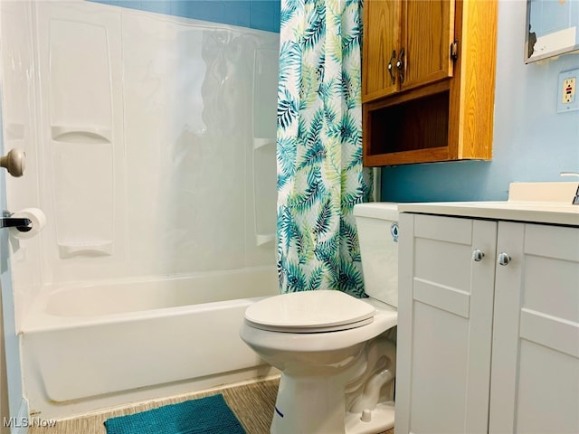 full bathroom featuring vanity, shower / bath combination with curtain, and toilet