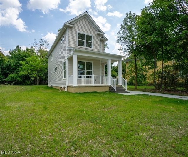 view of front of property featuring a porch and a front yard