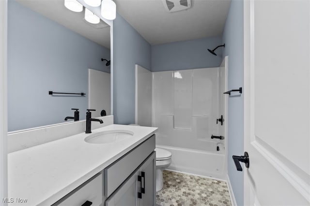 full bathroom with toilet, shower / bathing tub combination, and vanity