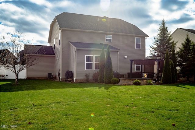 back of house with a patio area, central AC, and a lawn