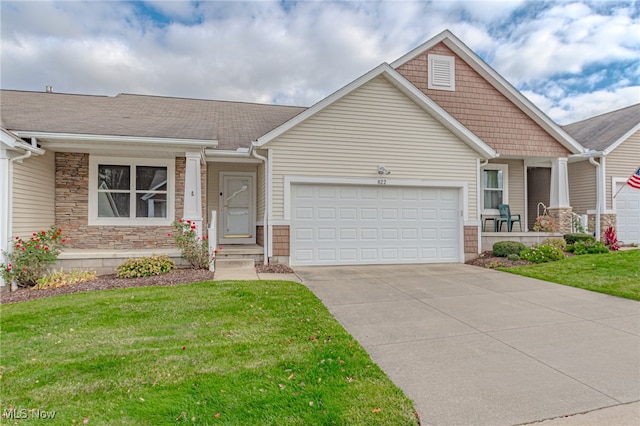 view of front of house featuring a garage and a front lawn