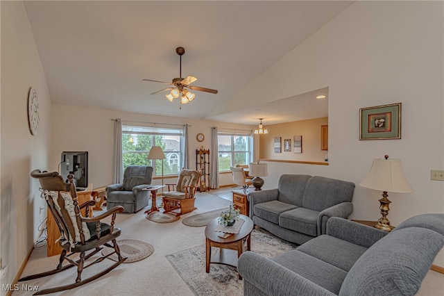 carpeted living room featuring ceiling fan and high vaulted ceiling