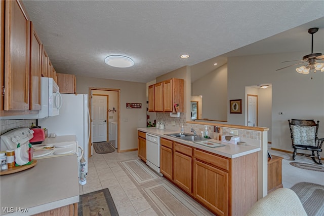 kitchen with light tile patterned flooring, backsplash, a textured ceiling, vaulted ceiling, and white appliances