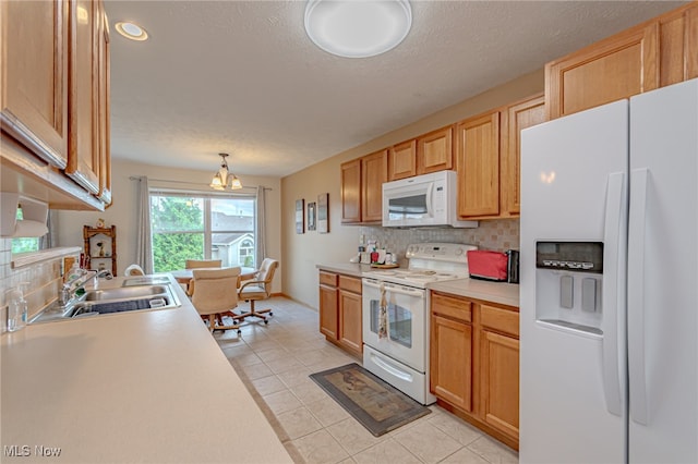 kitchen featuring decorative backsplash, a notable chandelier, light tile patterned floors, pendant lighting, and white appliances