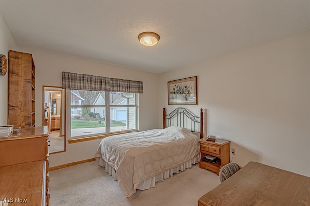 bedroom with light carpet