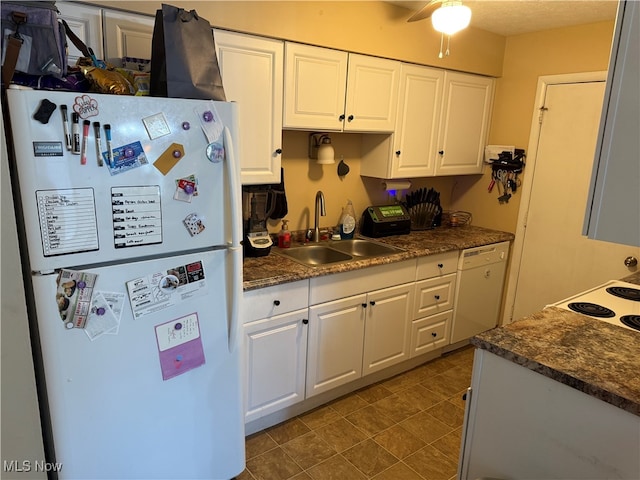 kitchen with white cabinets, sink, white appliances, and ceiling fan