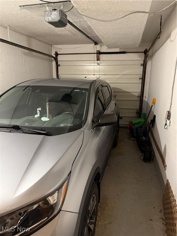 garage featuring a garage door opener