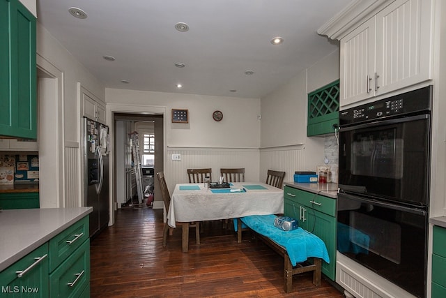 dining room with dark hardwood / wood-style flooring