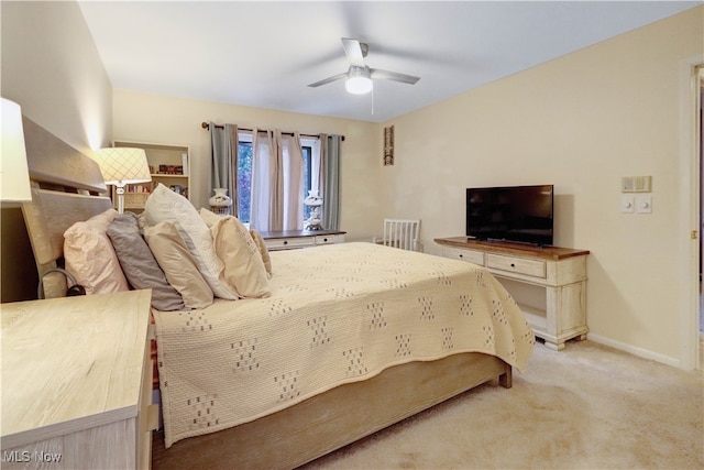 bedroom with light colored carpet and ceiling fan