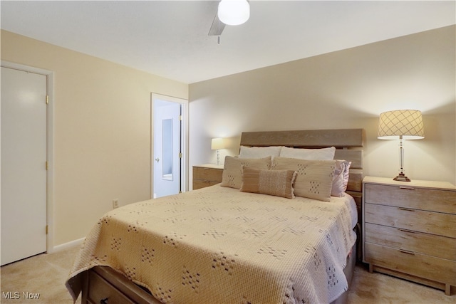 bedroom with ceiling fan and light colored carpet