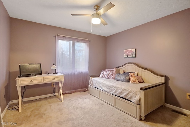 bedroom with light colored carpet and ceiling fan