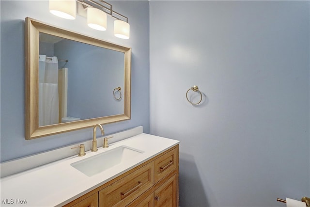 bathroom with vanity and toilet