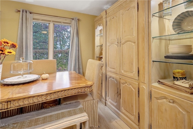 dining space with light hardwood / wood-style flooring