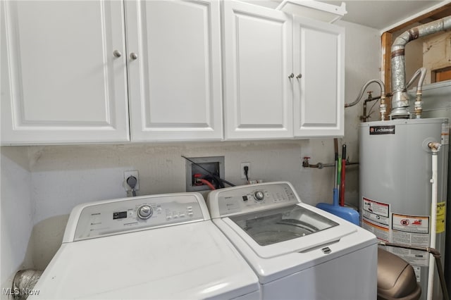 laundry area featuring cabinets, washing machine and dryer, and gas water heater