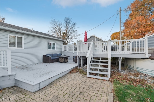 wooden deck with a patio area