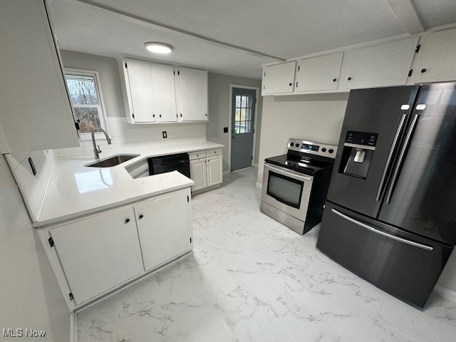 kitchen featuring white cabinets, a healthy amount of sunlight, sink, and appliances with stainless steel finishes