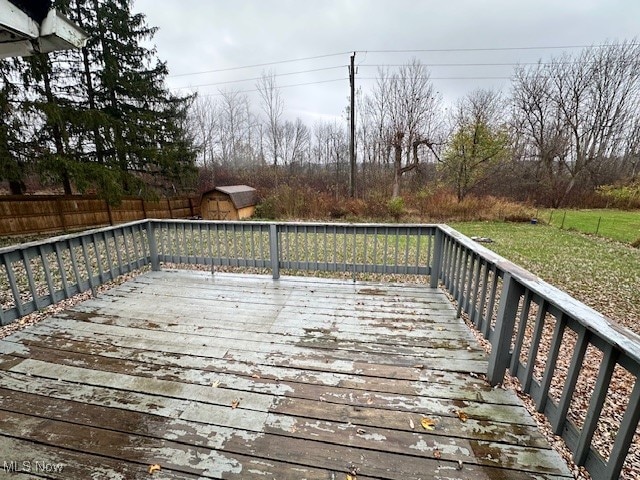 wooden deck with a shed