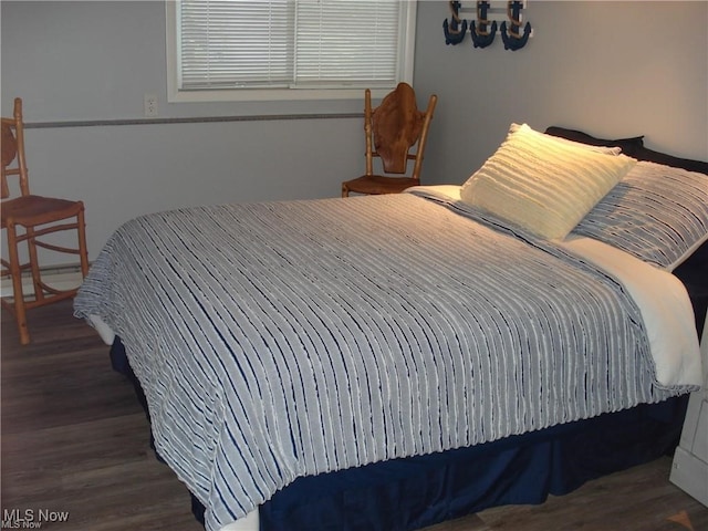 bedroom featuring dark hardwood / wood-style flooring