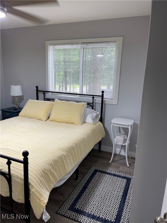 bedroom featuring ceiling fan and wood-type flooring