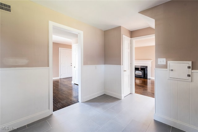 corridor with wood-type flooring