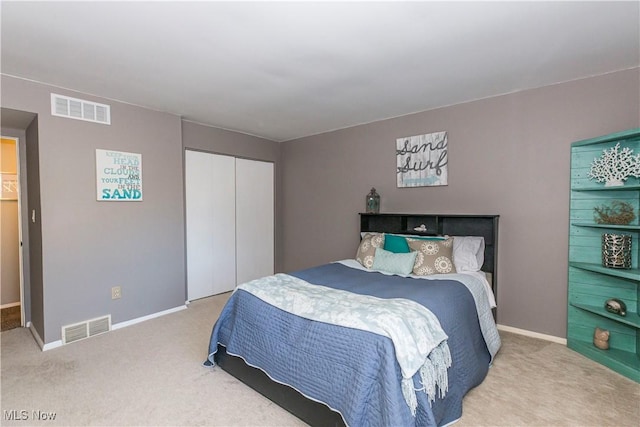 carpeted bedroom featuring a closet