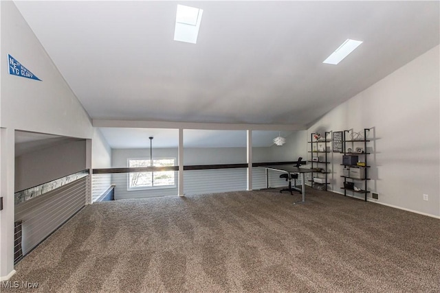 interior space featuring carpet flooring and vaulted ceiling