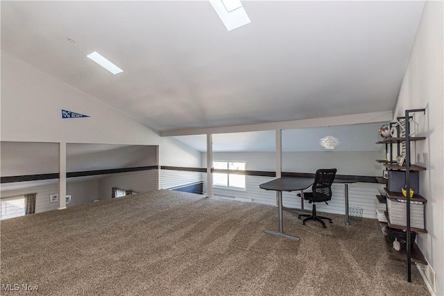 home office featuring lofted ceiling and carpet flooring