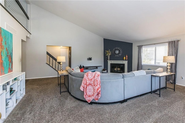 living room featuring carpet floors and lofted ceiling