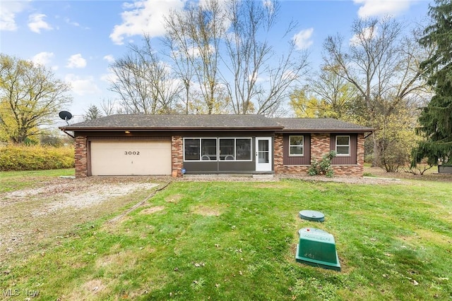 single story home with a front yard and a garage