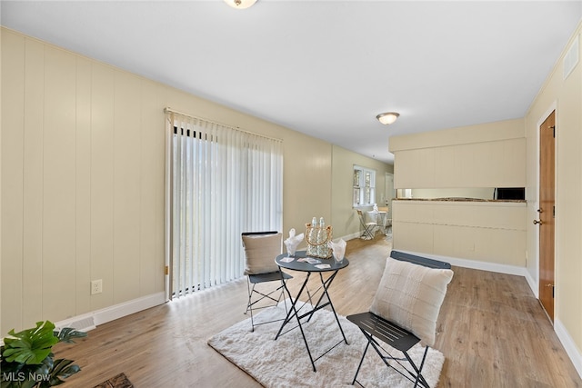 dining room with light hardwood / wood-style floors