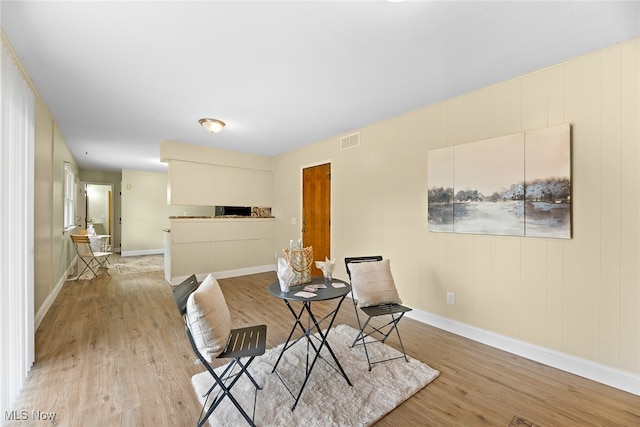 living area with light hardwood / wood-style floors