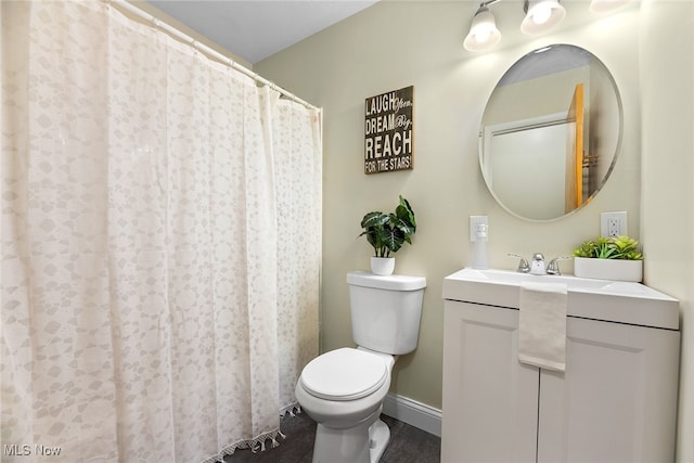 bathroom featuring hardwood / wood-style flooring, vanity, and toilet