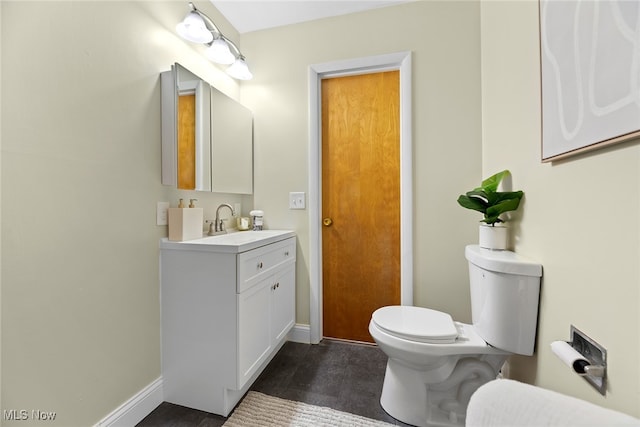 bathroom with vanity, wood-type flooring, and toilet