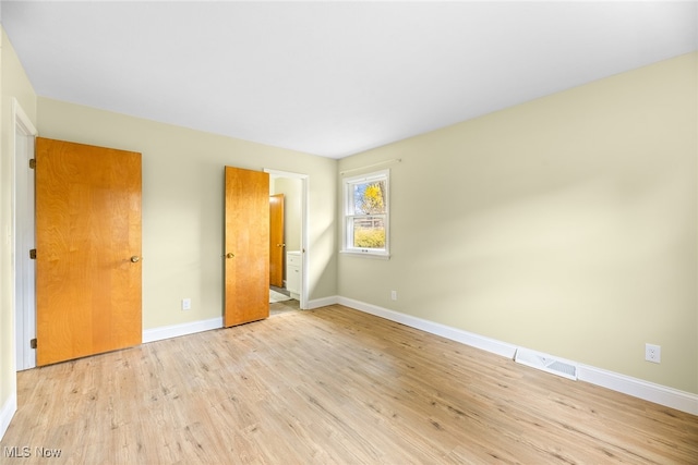 unfurnished bedroom featuring light hardwood / wood-style floors