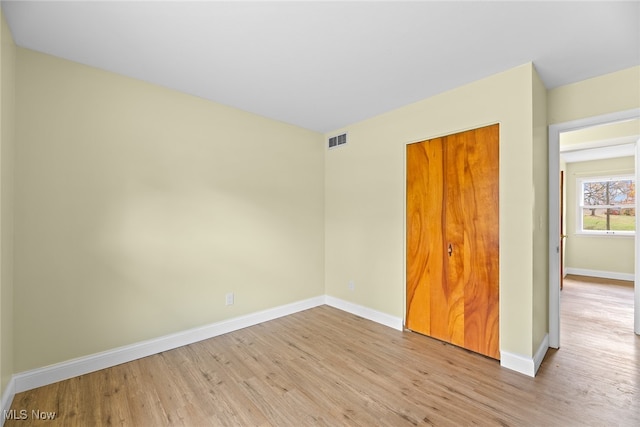 spare room featuring light hardwood / wood-style flooring