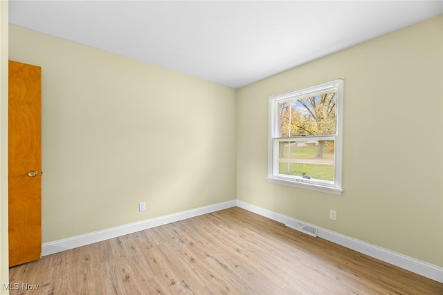 spare room featuring light hardwood / wood-style floors