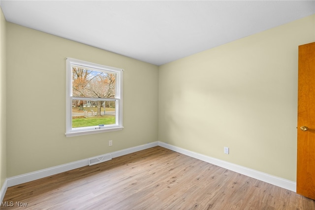 empty room with light hardwood / wood-style floors