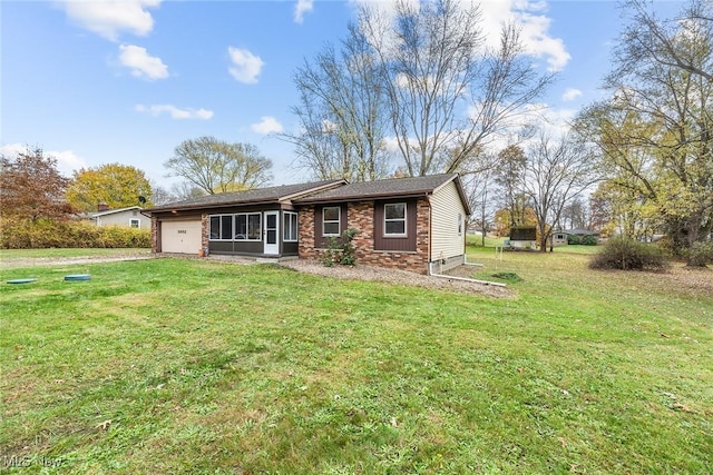 ranch-style house with a front yard and a garage