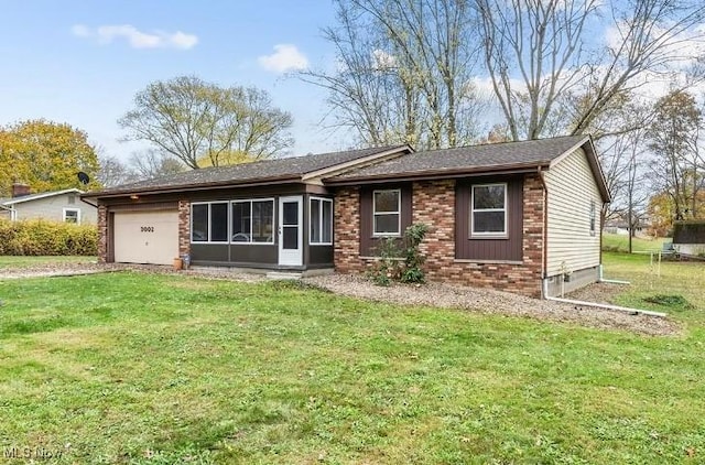 ranch-style house featuring a garage and a front lawn