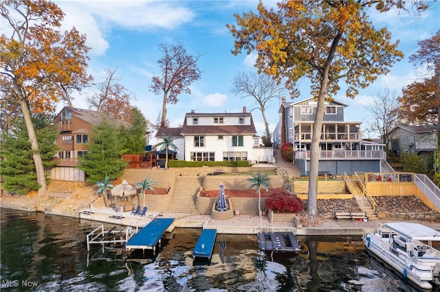 back of house featuring a water view