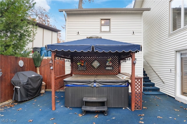 view of patio with a hot tub and area for grilling