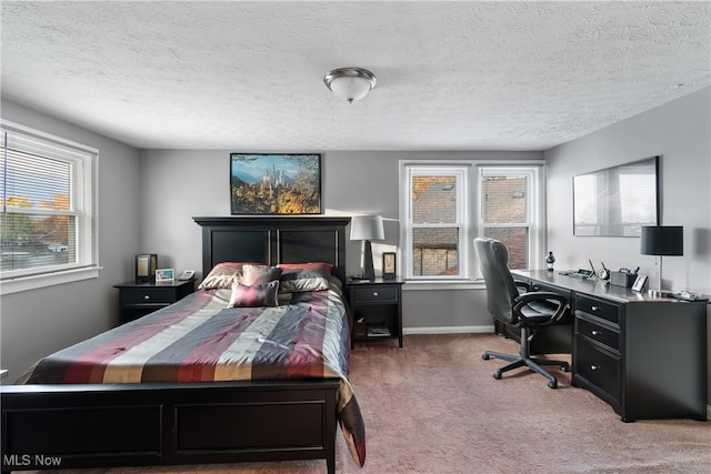 carpeted bedroom featuring a textured ceiling