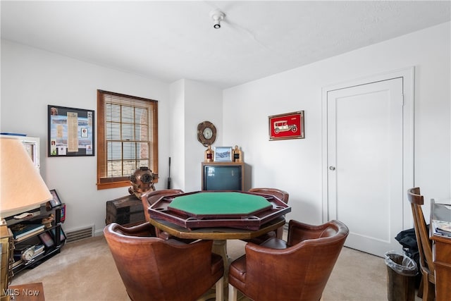 game room featuring light colored carpet