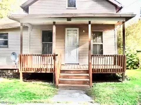 rear view of house with covered porch