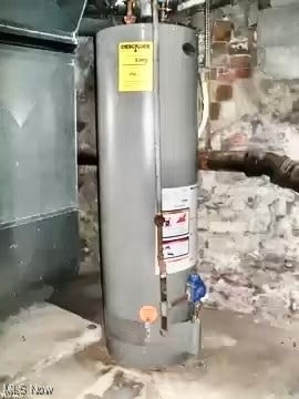 utility room featuring water heater