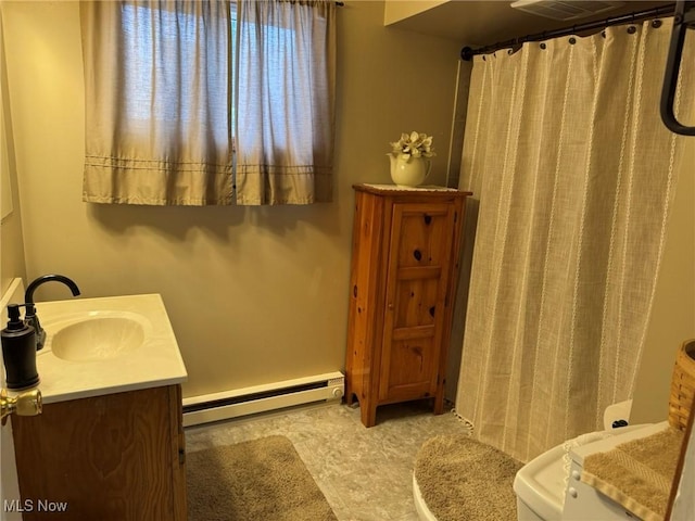 bathroom with vanity and a baseboard radiator